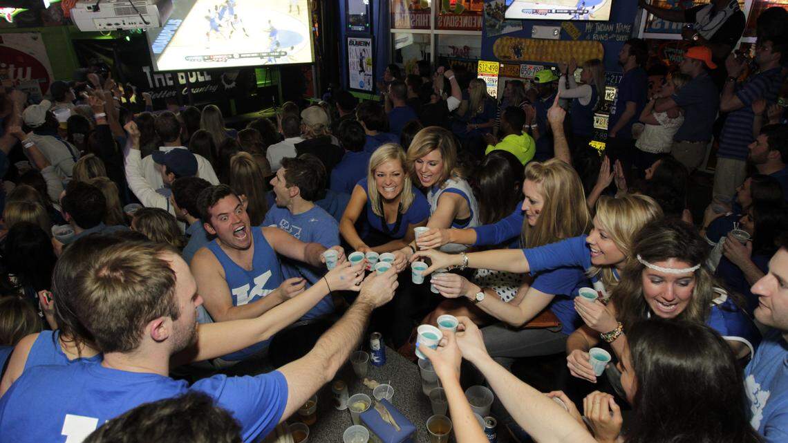 Fans watched the first half of the Kentucky vs Louisville men's NCAA sweet sixteen game at the Tin Roof on Limestone St. in  Lexington, Ky., on March 28, 2014. Photo by Pablo Alcala | Staff