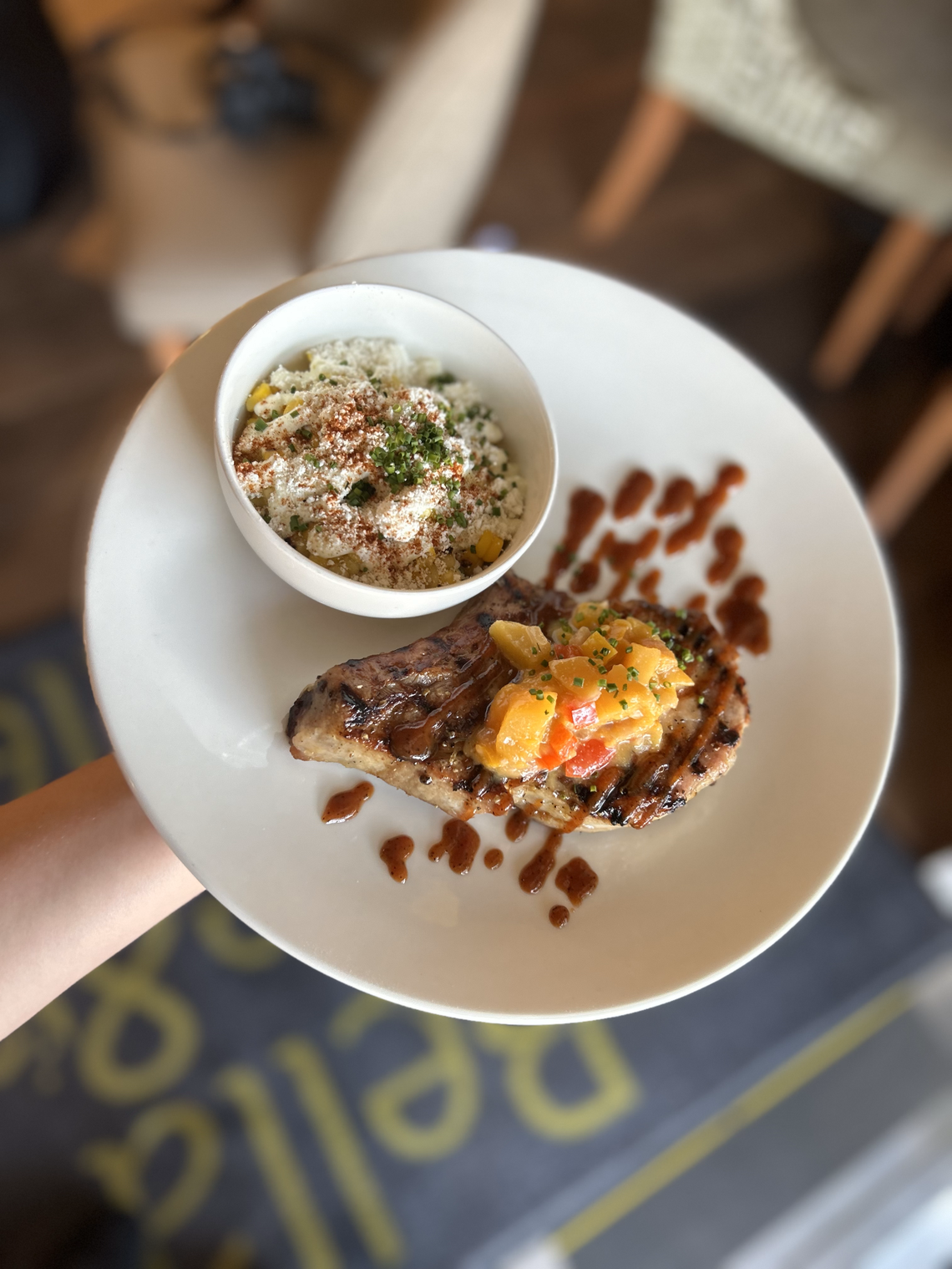 Bella Cafe & Grille will participate in Lexington Restaurant Week from July 17-27, including a pork chop entree served with grilled corn elotes, peach mostardo and BBQ gastrique.