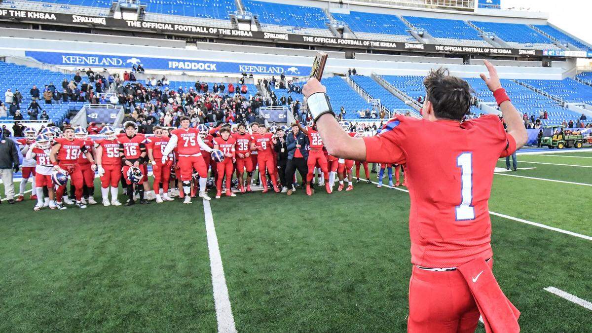 Christian Academy quarterback Connor Hodge (1) greets his teammates after claiming the Class 3A state championship game MVP award.