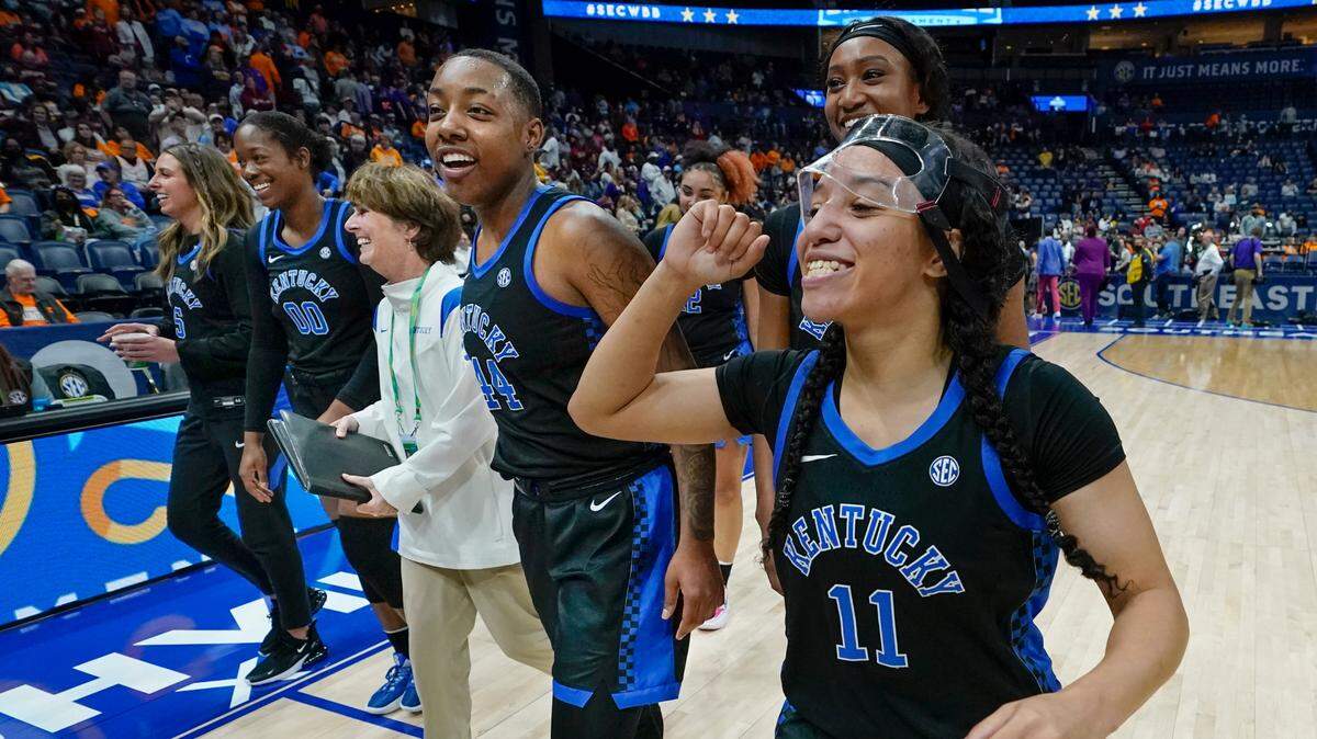 Kentucky’s Jada Walker (11), Dre’una Edwards (44) and Olivia Owens (00) celebrate after the Wildcats defeated sixth-ranked and No. 2 SEC Tournament seed LSU on Friday night in Nashville. The win was UK’s eighth in a row.