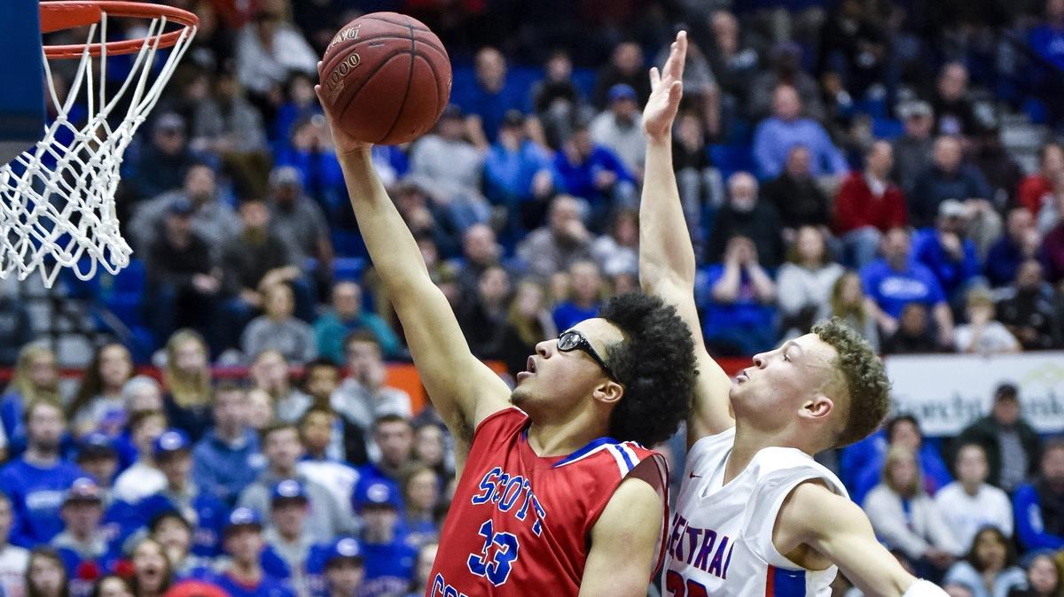 Scott County’s Lorenzo Williams beat Madison Central’s Kole Browne to the basket during their 11th Region Tournament quarterfinal game in Richmond on Monday night.