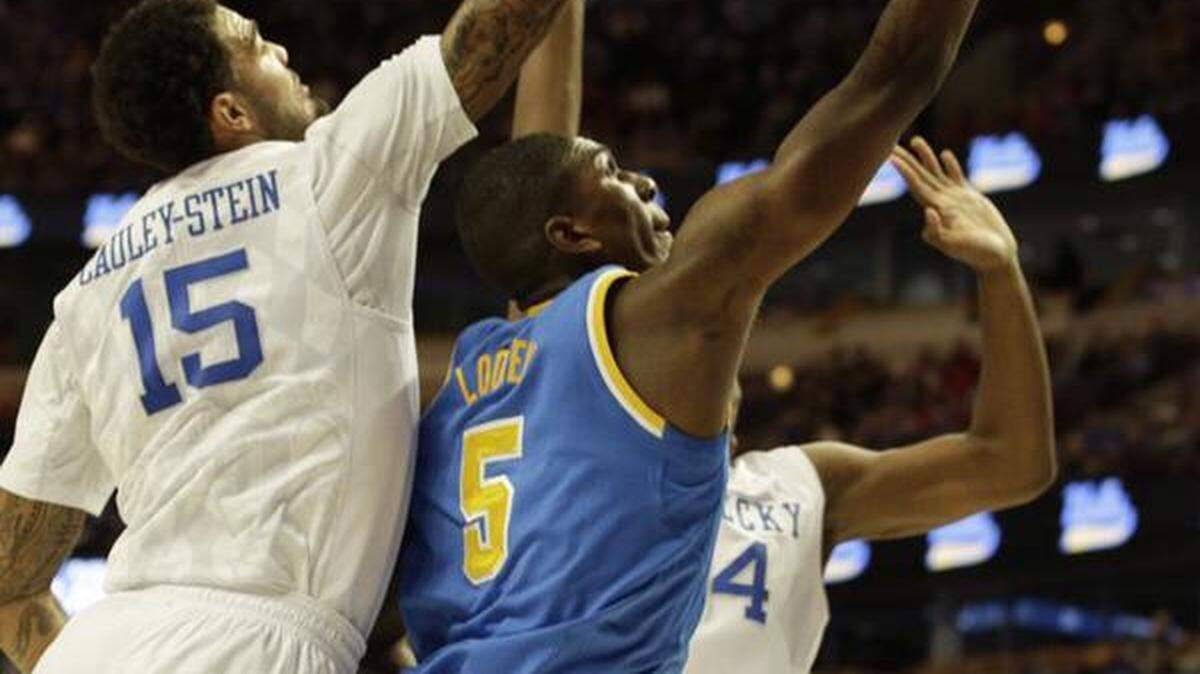 Action from UK-UCLA on Dec. 20, 2014.