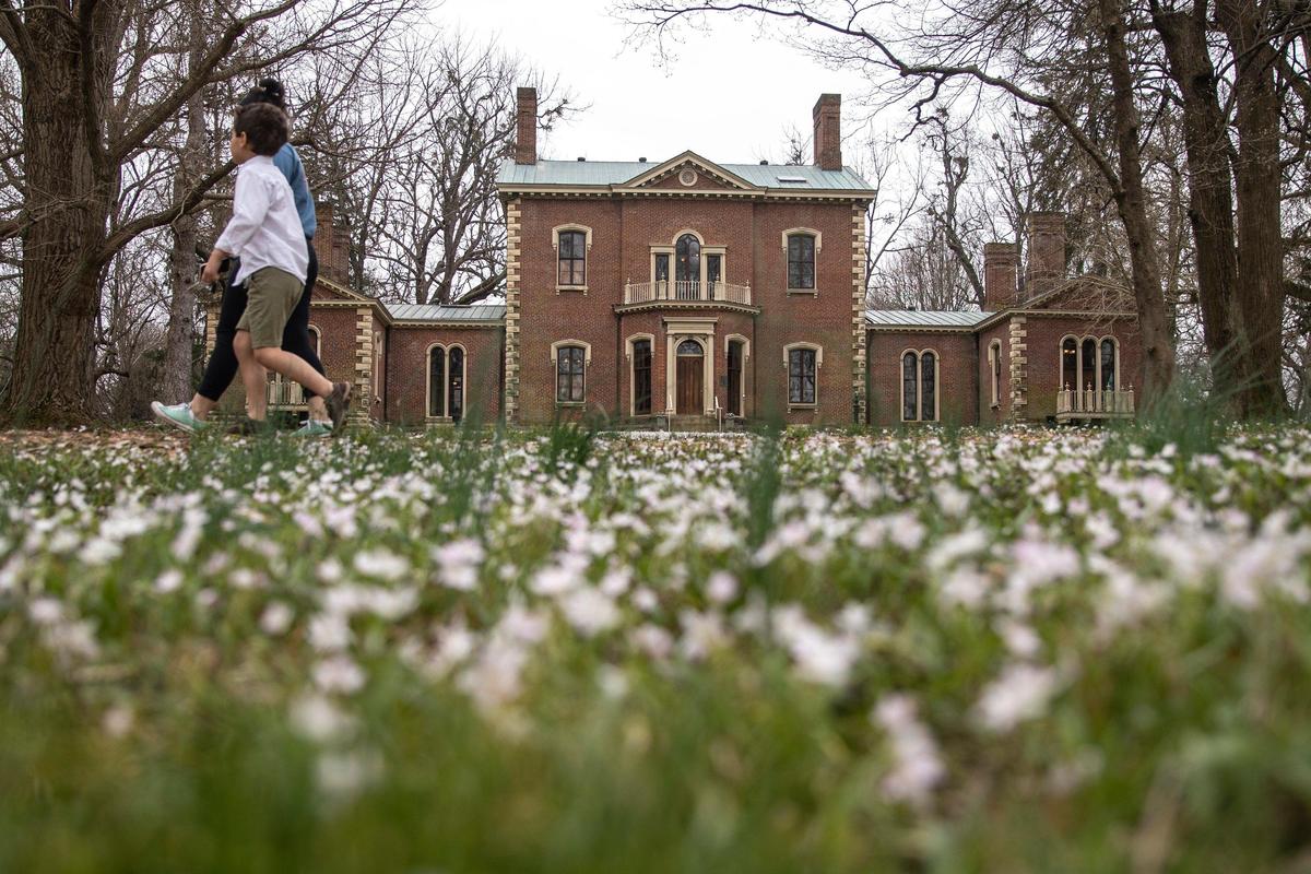 People walk along the trails Tuesday at Ashland, the Henry Clay Estate. The Ashland house is closed, but the grounds and formal gardens remain open to the public.