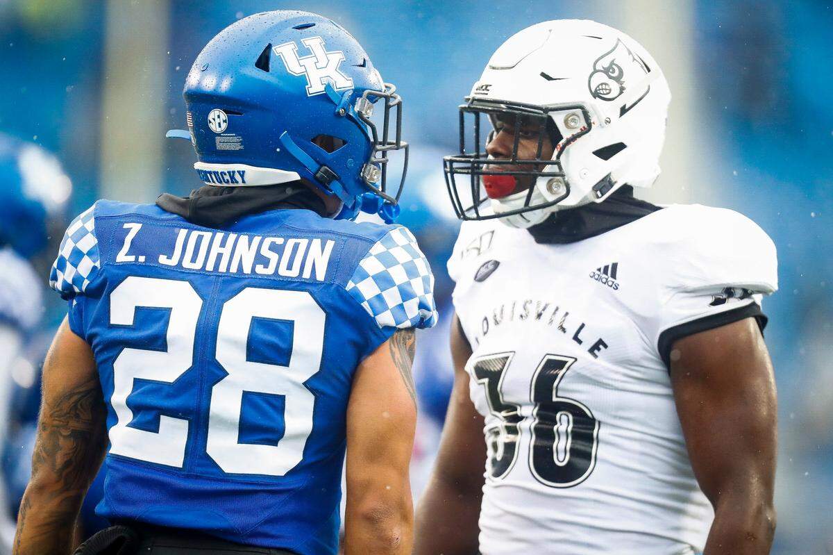 “Here’s a guy who just goes to the scout team every day and he does it with a smile on his face and busts his tail to give ‘em the best look he can all day, every day,” Mark Stoops said of Zach Johnson (28). “Yet then he goes out and has an impact (in games) because that’s his role. He accepts his role, he knows his role. ... We really look up to Zach and respect him.”