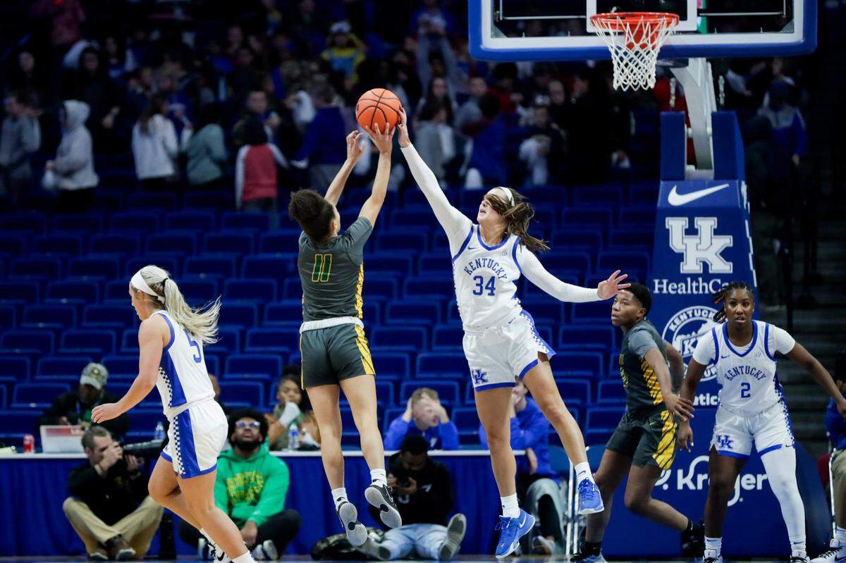 Kentucky’s Emma King (34) blocks a shot by Kentucky State’s Gracen Kerr on Wednesday. Kerr led KSU with 23 points. King finished with 12 points and blocked a pair of shots.