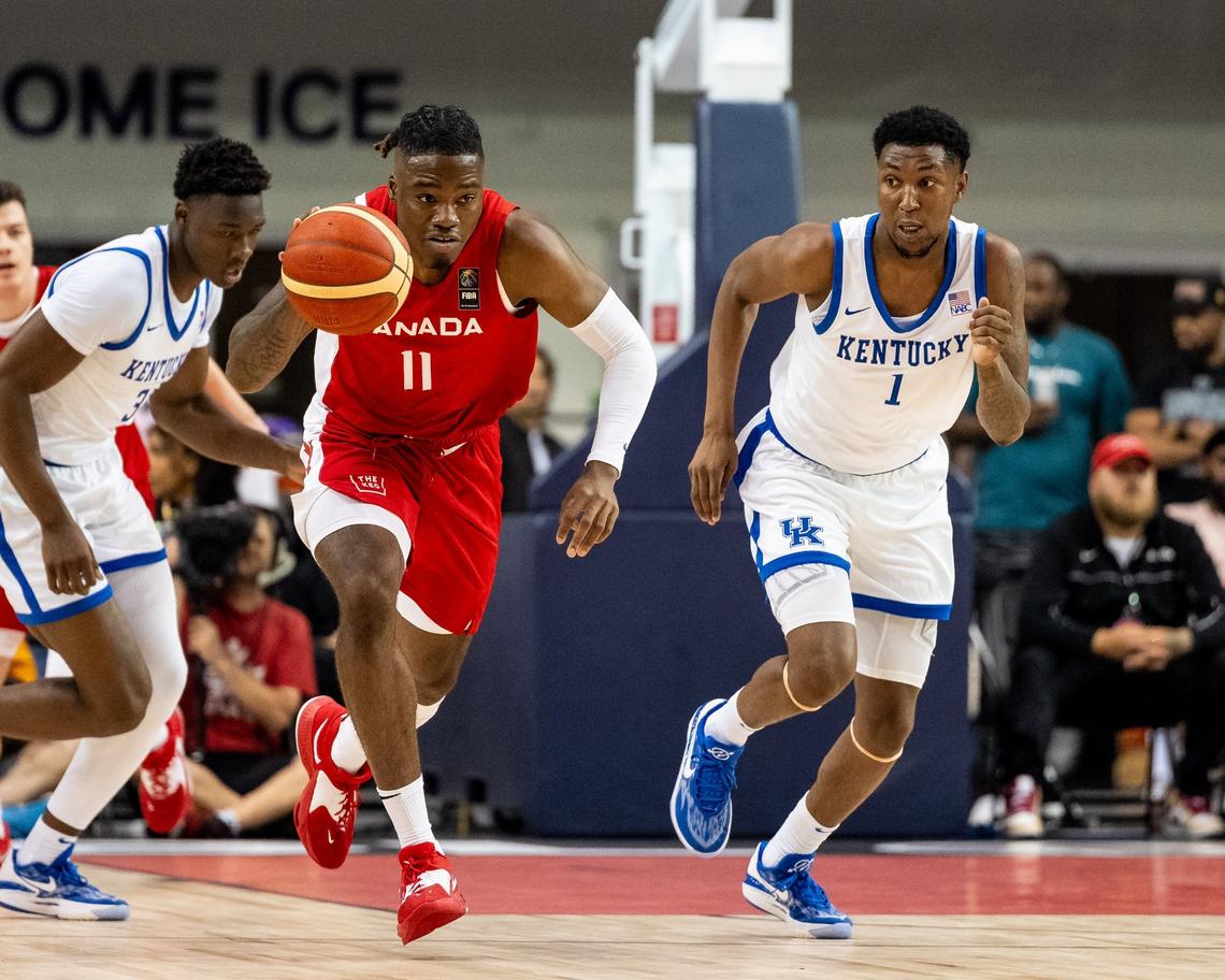 Kentucky’s Justin Edwards (1) tries to track down Canada’s Jahmyl Telfort during Sunday night’s game in Toronto. Edwards led the Wildcats with 23 points.