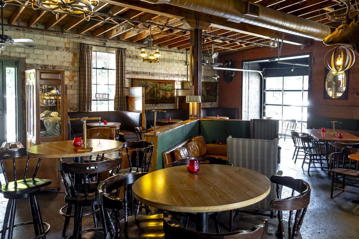 The Elkhorn Tavern, in Lexington's Distillery District, is adorned with animal mounts, leather furnishings and green, brassy accents
