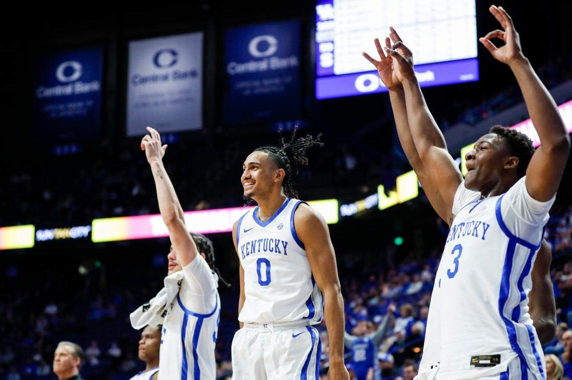 Lance Ware, left, Jacob Toppin, center, and Adou Thiero celebrate during the second half of Kentucky’s win over South Carolina State.