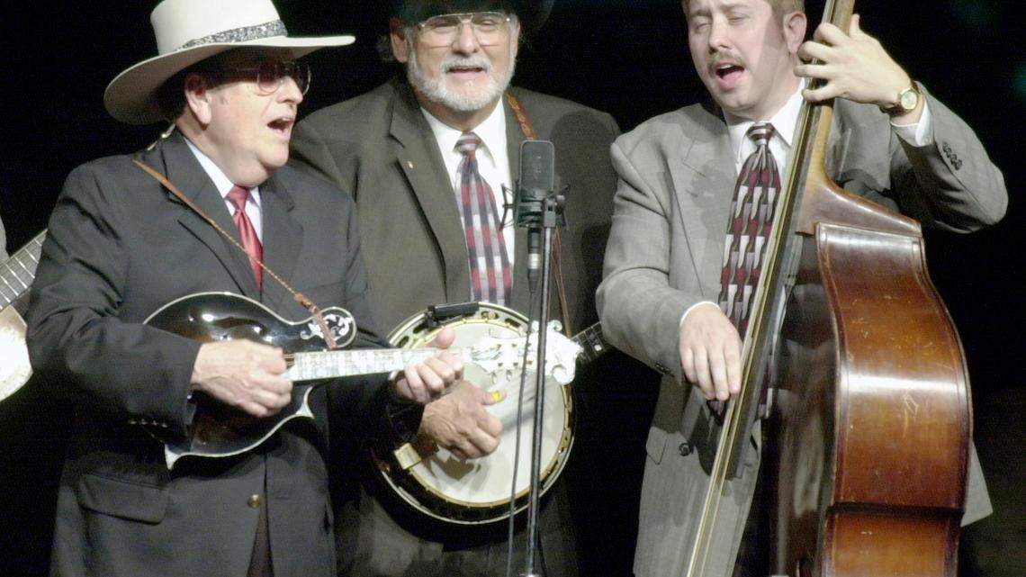Bobby Osborne, left, plays the mandolin, Sonny Osborne, middle, plays the banjo and Daryl Mosley, on bass, sing “Kentucky,” Thursday afternoon, April 11, 2002, during the International Bluegrass Music Museum’s grand reopening at the RiverPark Center in Owensboro, Ky. (AP Photo/The Messenger-Inquirer, John Dunham)