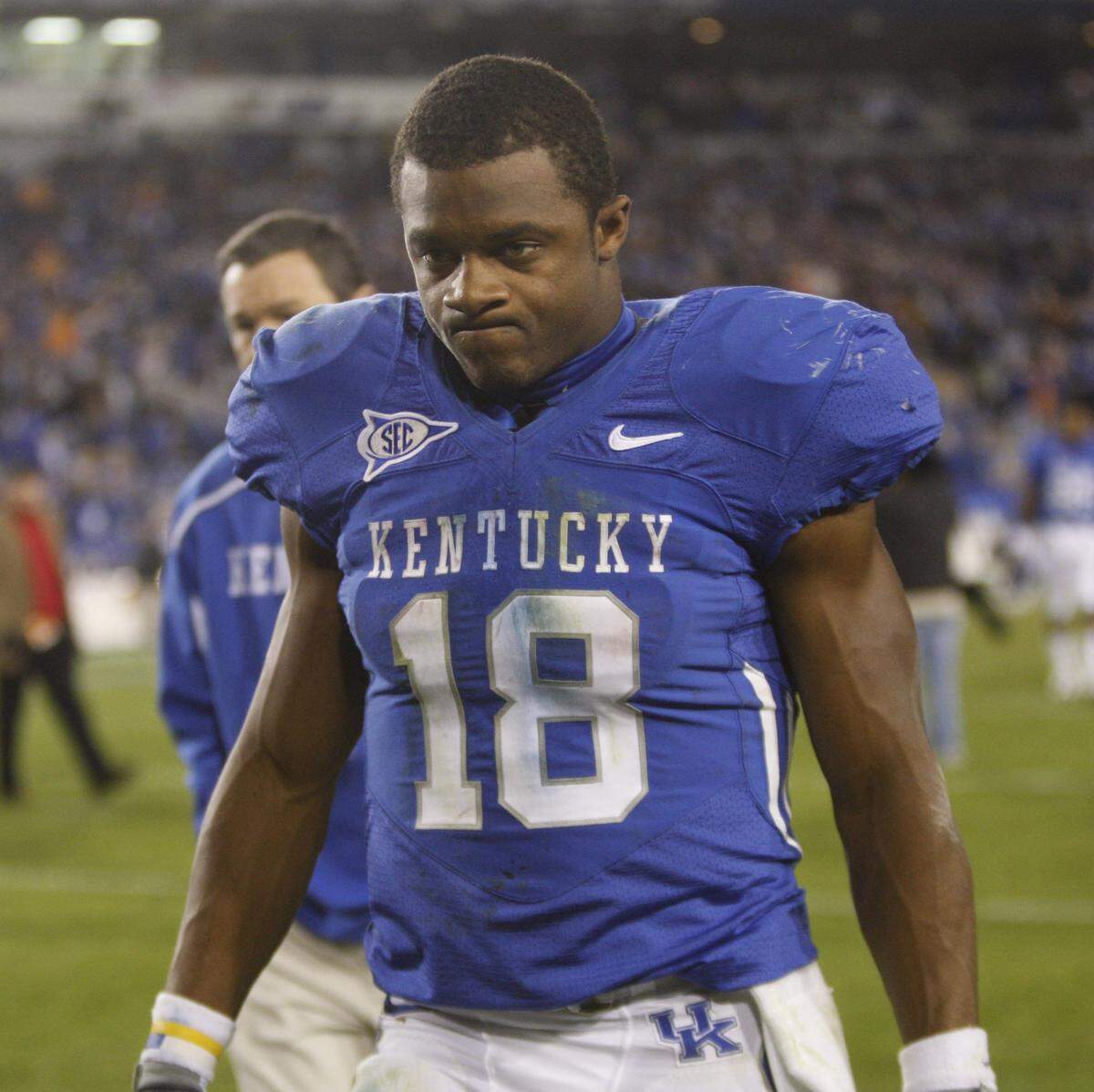 Kentucky star Randall Cobb left the field after UK’s 30-24 overtime loss to Tennessee in 2009.