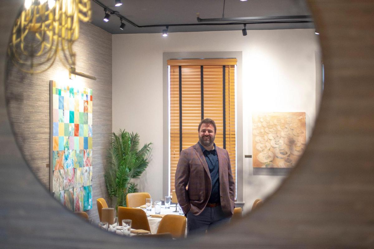 Julian Vallozzi, a co-owner, poses for a portrait in a downstairs dining room. “Vallozzi’s is a family tradition of Italian food and Italian restaurants. My grandmother started it in the 1950s,” co-owner Julian Vallozzi said.