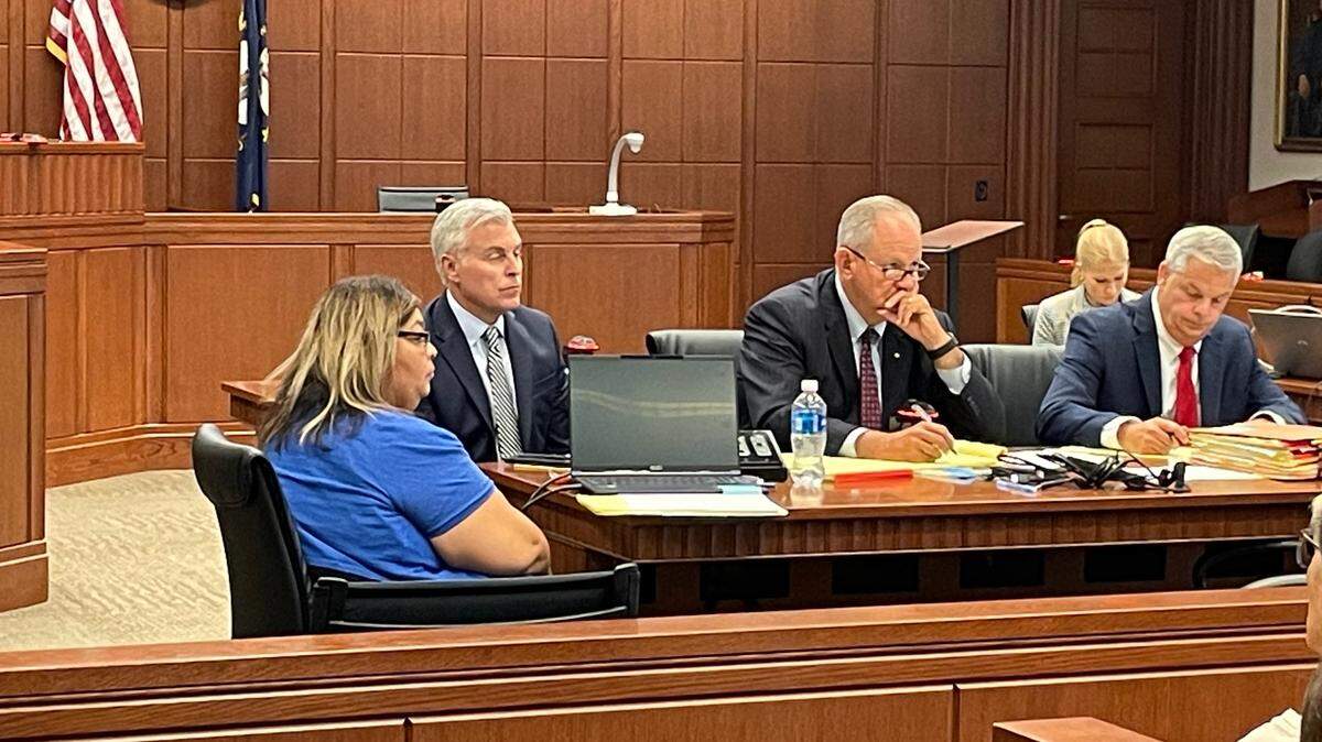 John Tilley (left) begins trial on Monday, alongside his attorneys, Steve Schroering (right) and Christopher Spedding (center).