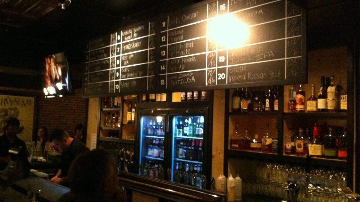 The bar at The Village Idiot has 20 rotating draft beers. It's in a building that housed Lexington's first post office.