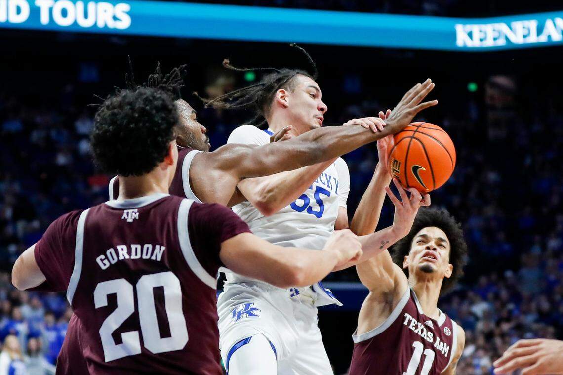 Kentucky forward Lance Ware (55) fights for control of a rebound against Texas A&M’s Andersson Garcia (11) during Saturday’s game at Rupp Arena.