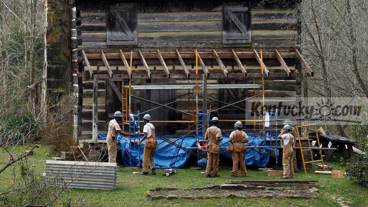 Frenchburg Job Corps students worked Wednesday on the porch at the historic Gladie cabin near the Gladie Learning Center in the Red River Gorge. The students are helping the U.S. Forest Service restore the cabin. The students have helped remove the deteriorating shingles from the cabin. On Wednesday, they set up scaffolding to prepare for the installation of new handmade wooden shakes. Volunteers have made about 2,000 wooden shakes at the site. Photo by Charles Bertram | Staff