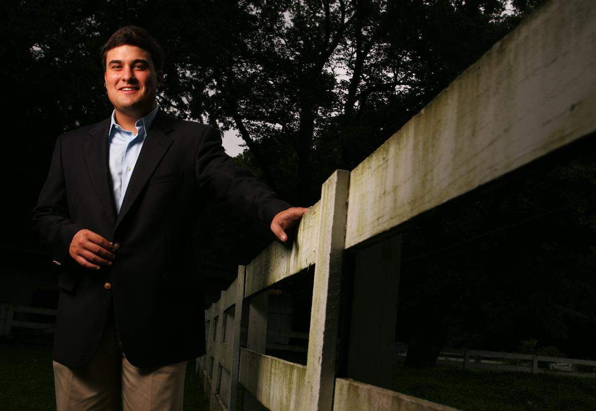 Nate Morris, a Bush-Cheney '04 fundraising 'Maverick' at 23, is shown outside his home in Louisville, Ky., on July 26, 2004.