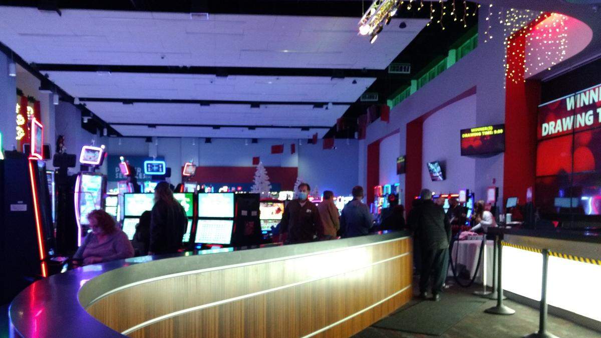Patrons stood in a line while others played games at Red Mile Tuesday night.