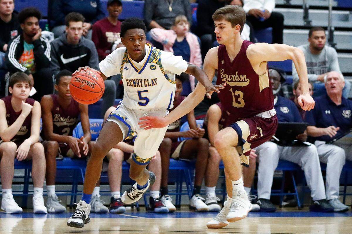 Henry Clay’s Kanye Henderson (5) dribbles past Bourbon County’s Jack Huckabay (13) during the Henry Clay Holiday Invitational finals at Henry Clay High School in Lexington, Ky., Saturday, Dec. 21, 2019. Henry Clay beat Bourbon County 70-67.