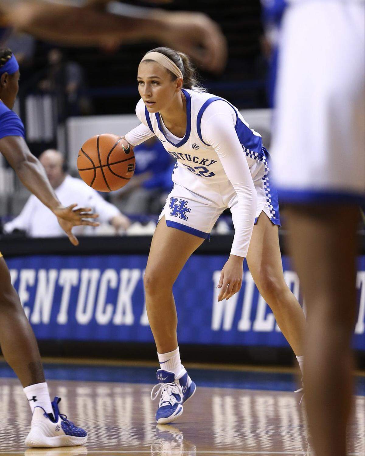 Maddie Scherr takes on a Morehead State defender during Friday night’s Kentucky victory in Memorial Coliseum. Scherr led the Wildcats with 14 points.