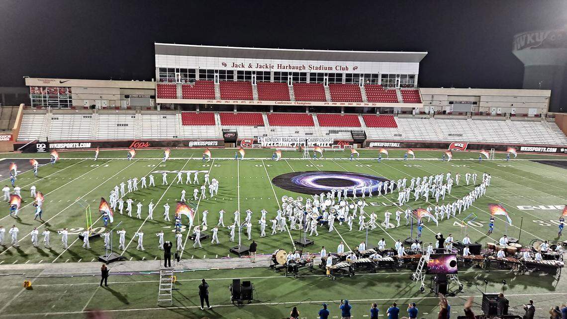 Members of the Lafayette High School Marching Band form the shape of a rocket ship during their performance of “A New Dawn” at the 2023 Kentucky Marching Band Championships at Western Kentucky University in Bowling Green on Oct. 28, 2023. Photo by John Stamper.