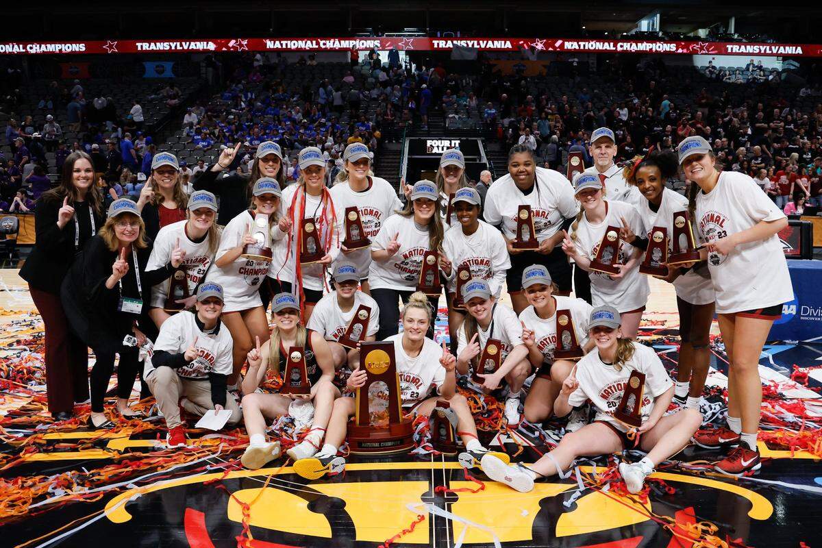 The Transylvania women’s basketball team poses for a photo after winning the NCAA Division III championship at American Airlines Center in Dallas.