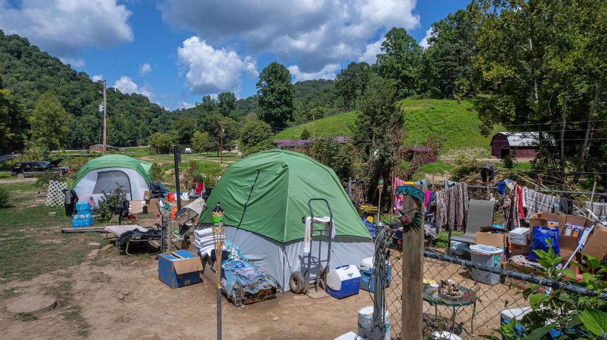 Jack Alsept, along with his wife, Sherry, are staying in tents at their flooded house in Perry County, Ky., as they work to clean and salvage what they can.