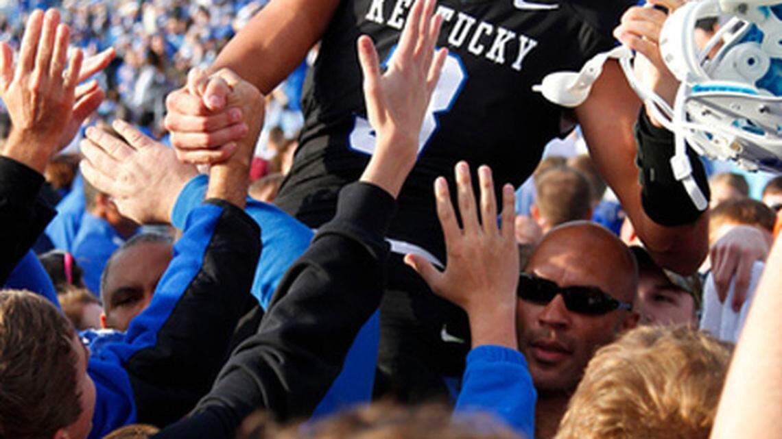 Kentucky quarterback Matt Roark was carried off the field by fans and teammates after the Wildcats defeated Tennessee, UK's first win over the Volunteers since 1984.