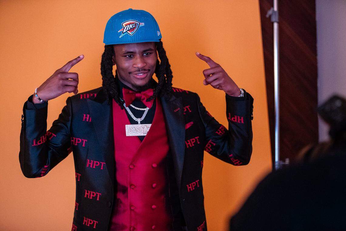Kentucky’s Cason Wallace tries on an Oklahoma City Thunder cap after being traded by the Dallas Mavericks on NBA Draft night in Brooklyn, New York.