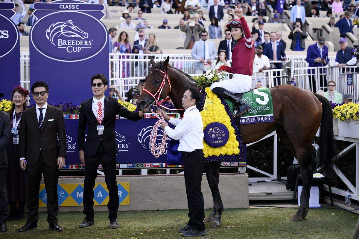 DEL MAR, CALIFORNIA - NOVEMBER 01: Ryusei Sakai #5 poses for photos in the winners circle aboard Forever Young after winning the Breeders' Cup Classic race on day two of the 2025 Breeders' Cup World Championships at Del Mar Race Track on November 01, 2025 in Del Mar, California. (Photo by Sean M. Haffey/Getty Images)