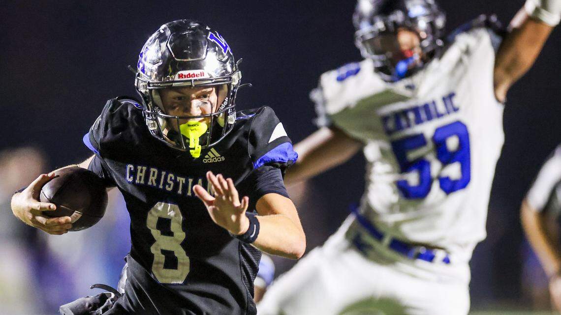 Lexington Christian's Nash Whelan (8) runs past the pursuit of Lexington Catholic's Jacob Dudek (59) during LCA's 28-21 win over Lexington Catholic during a high school football game, Friday, Sept. 19, 2025 at Lexington Christian Academy in Lexington, Ky.