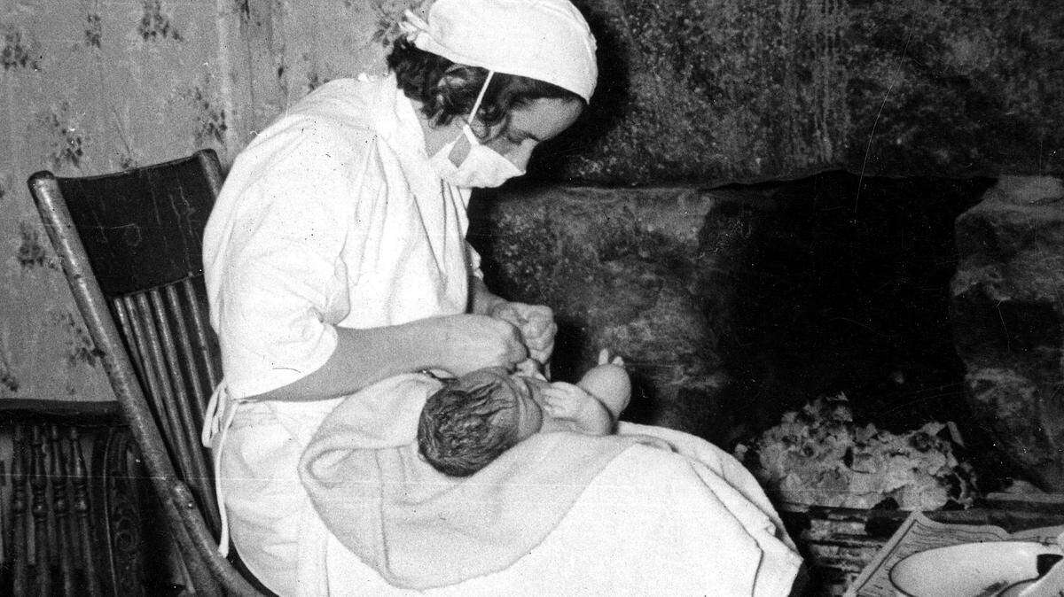 A Frontier Nursing Service nurse delivered a baby at a home in the 1930s. When Mary Breckinridge started the rural health care experiment in Leslie and Clay counties in 1925, the area had few roads, so nurses rode horses.   