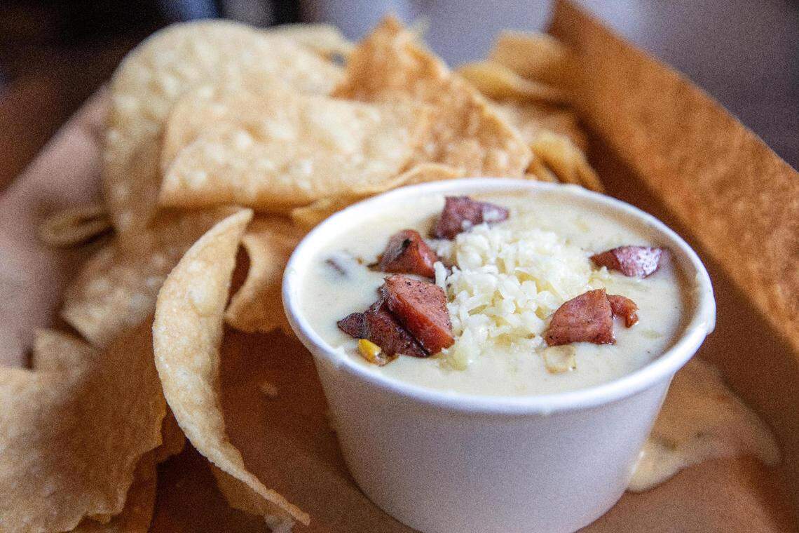 Appetizers include tortilla chips with andouille queso at Agave & Rye’s new downtown Lexington location.