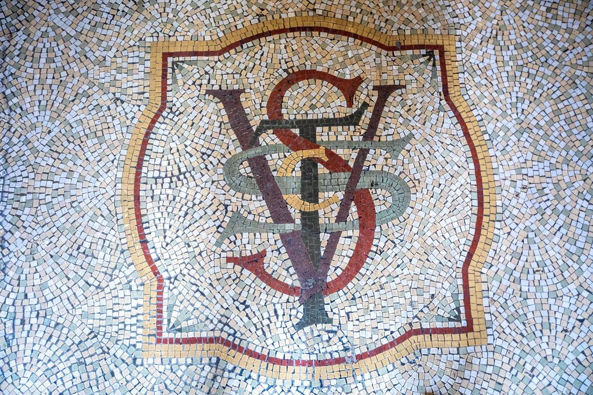 The tile mosaic at the entrance highlights the building’s origin as the Security Trust Company Vaults and Storage. Many original vaults remain.