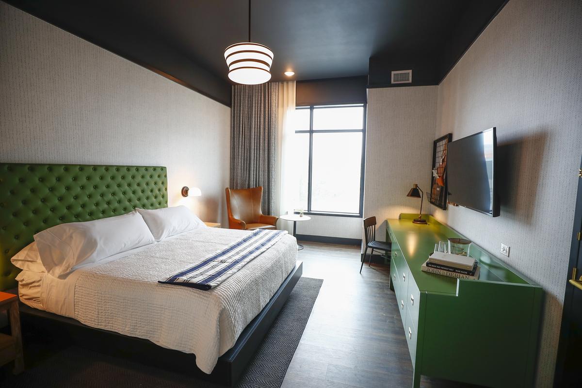 A standard guest room at the new Origin Hotel. The rooms come with Netflix but without closets to give guests more space.
