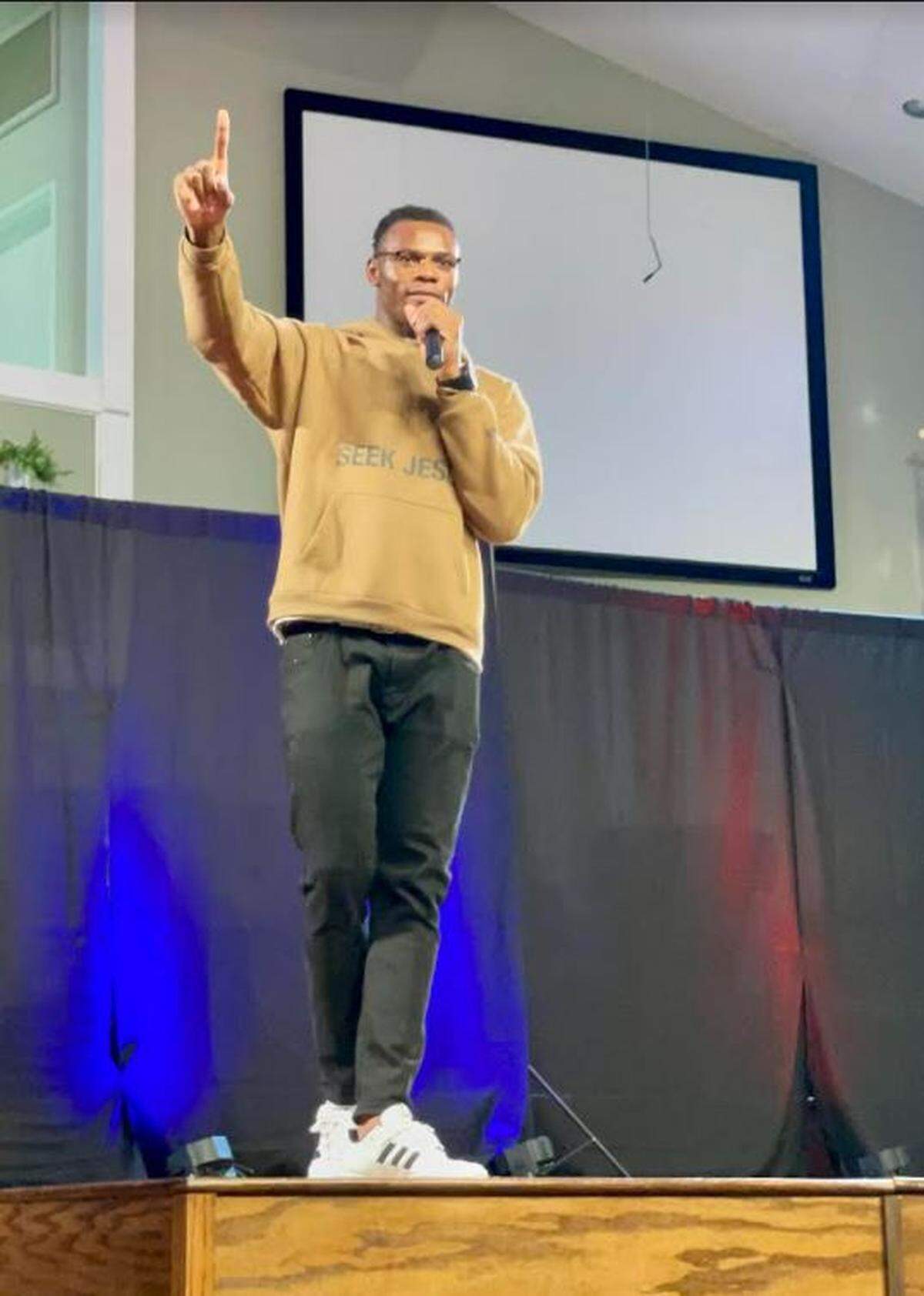 University of Kentucky basketball star Oscar Tshiebwe addresses the crowd during an African Worship Service at Broadway Baptist Church in Lexington.
