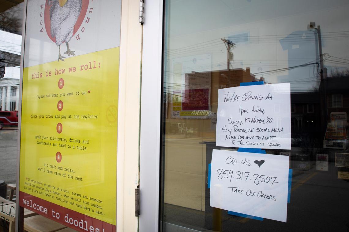 A sign on the door of Doodle’s in Lexington lets customers know of their change to takeout.