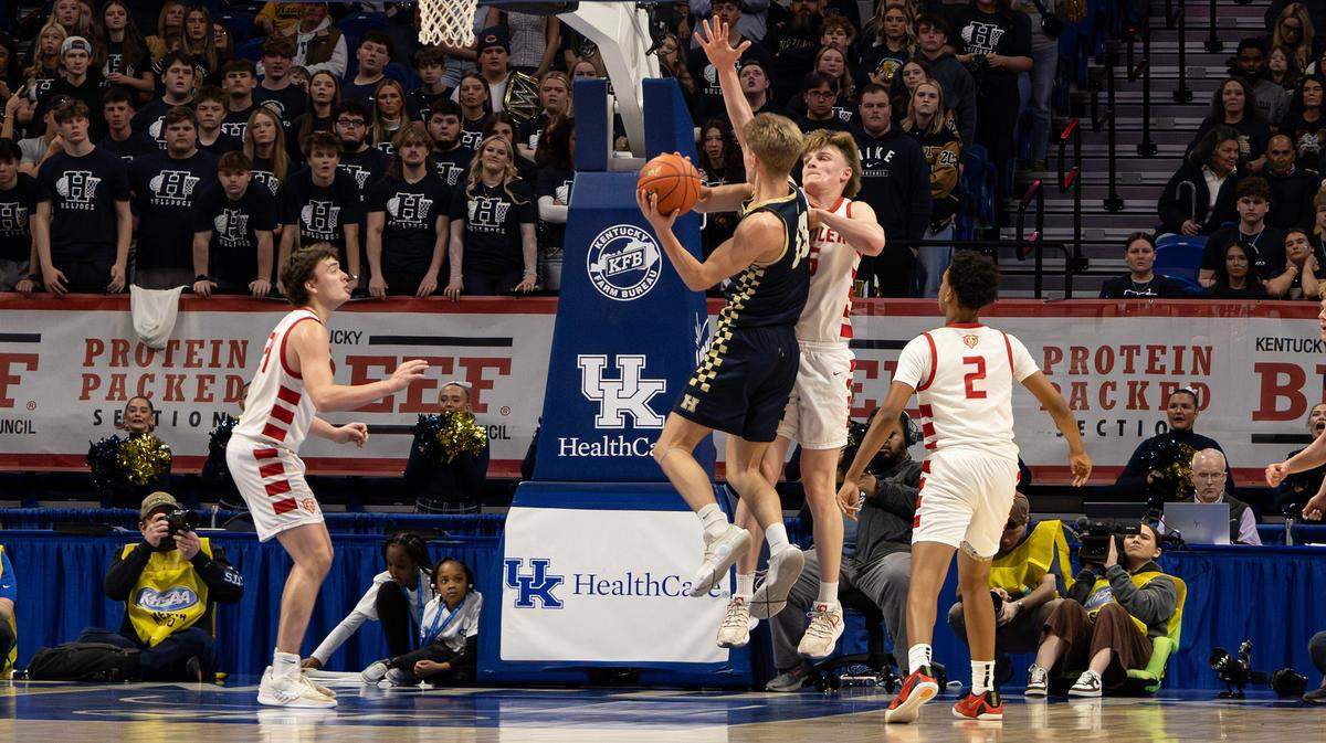 Louisville Butler's Brayden Wilkins blocks Hazard's Seth Caudill's attempt at a two-point layup during the UK HealthCare Boys' Basketball Sweet 16 state tournament first-round game between Louisville's Butler and Hazard at Rupp Arena in Lexington, Ky, on March 19, 2026.