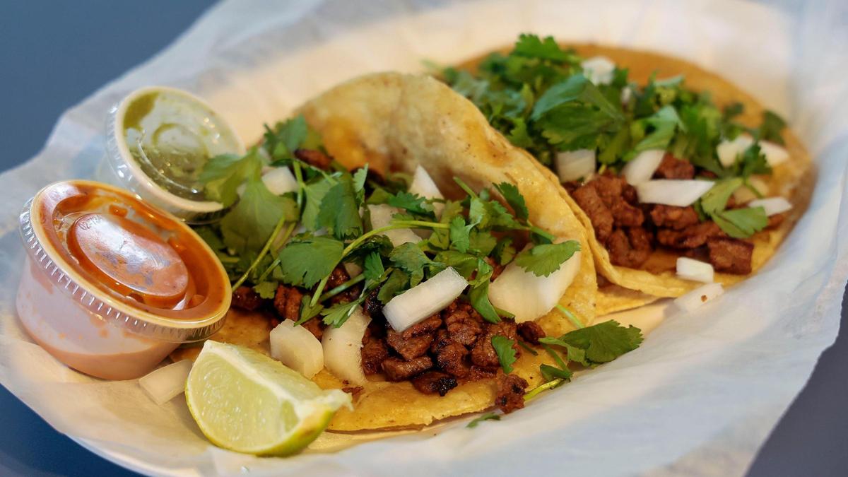 Two steak street tacos ($3.25 a piece) from JJ burgers and fries. The new restaurant also has chicken or pastor street tacos and nachos with your choice of meat ($9.75).