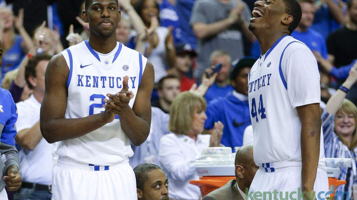 Kentucky Wildcats forward Alex Poythress (22) and Dakari Johnson celebrate on the sidelines  as Kentucky defeated Georgia 70-58 in the SEC tournament on Saturday March 15,  2014 in Atlanta,GA. Photo by Mark Cornelison | Staff