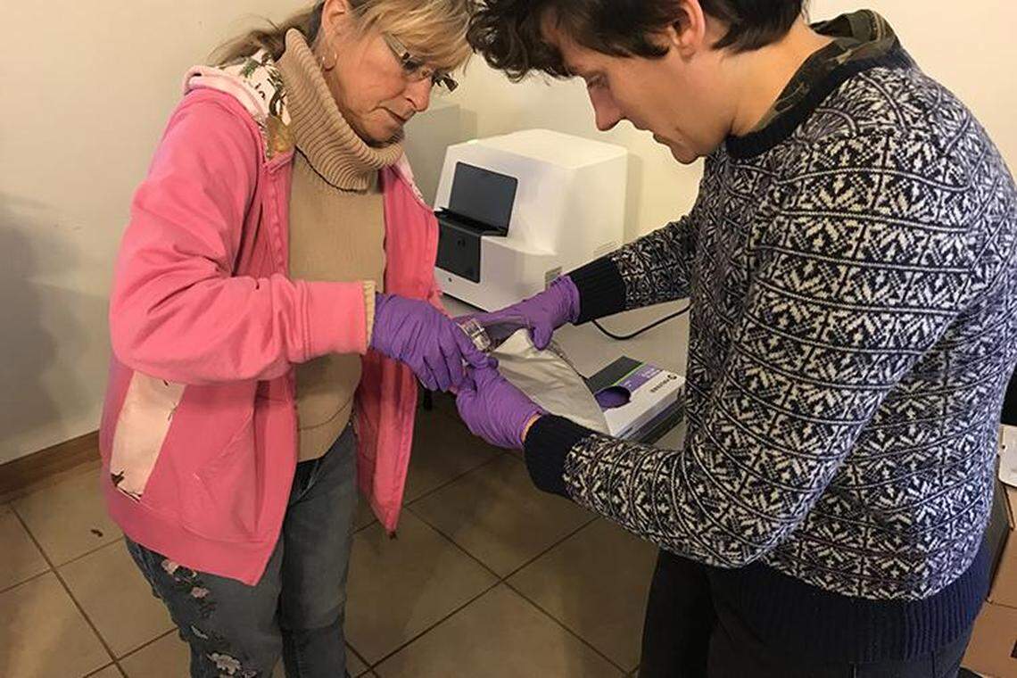 Nina McCoy, left, head of Martin County Concerned Citizens, and Ricki Draper, with LiKEN Knowledge, process samples taken in a project to test water quality.