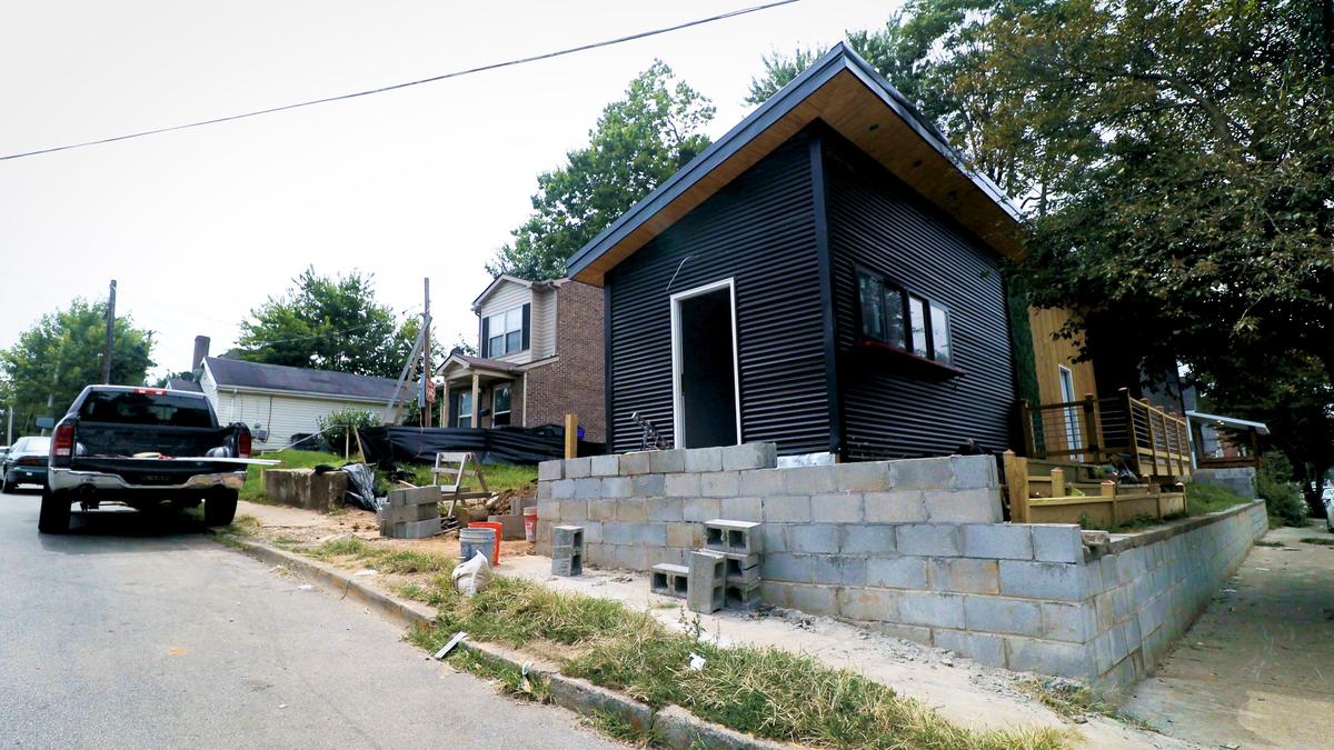A modern shotgun-style home under construction on East Seventh Street.