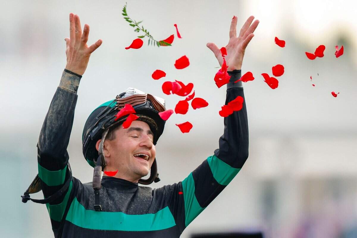 Jockey Brian Hernandez Jr. celebrates after winning the 150th running of the Kentucky Derby aboard Mystik Dan at Churchill Downs.