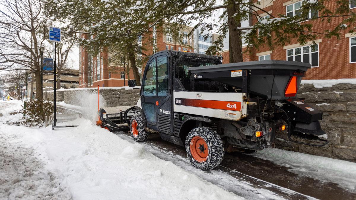 A plow cleared snow off of sidewalks next to UK’s dorms along South Limestone during UK’s move-In day Friday morning, January 7, 2022. Lexington had its first winter storm the previous day, resulting in several inches of snow blanketing the city.