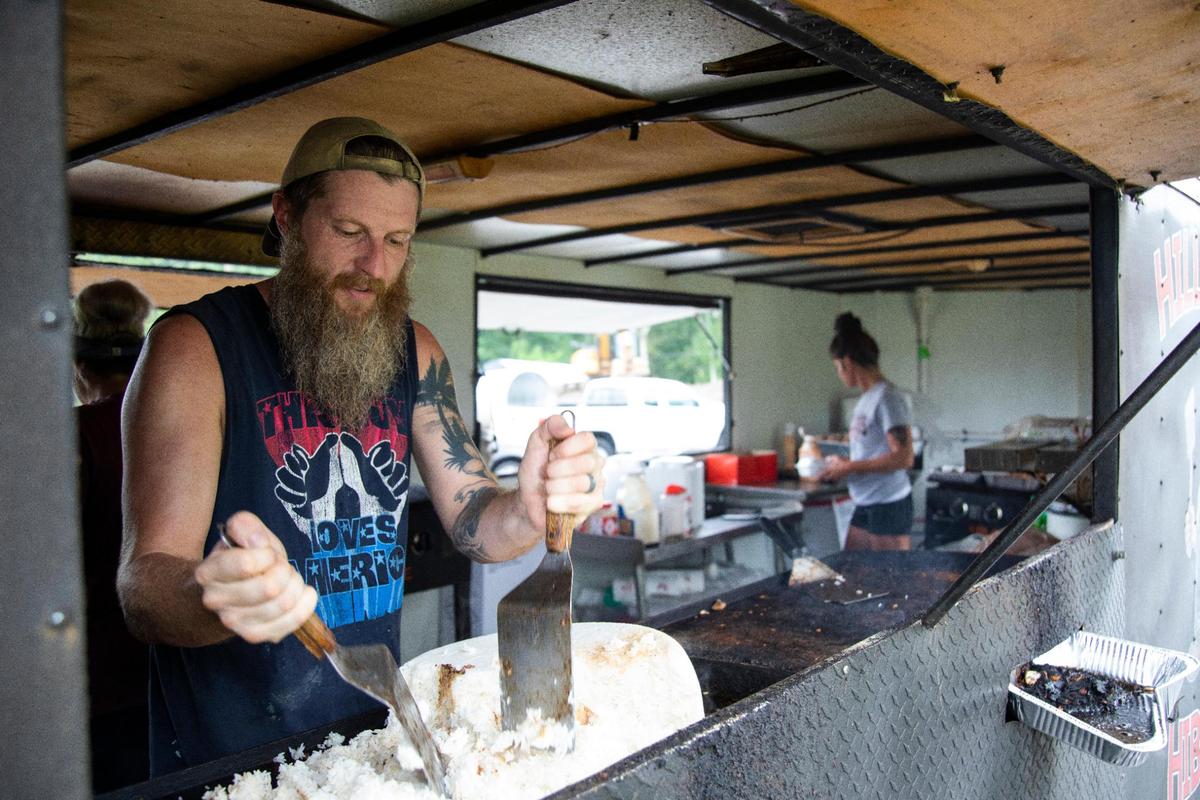 Co-owner Adam Brown cooks in the Hillbilly Hibachi food truck in Ashland. In recovery from addition he rediscovered his passion for cooking.