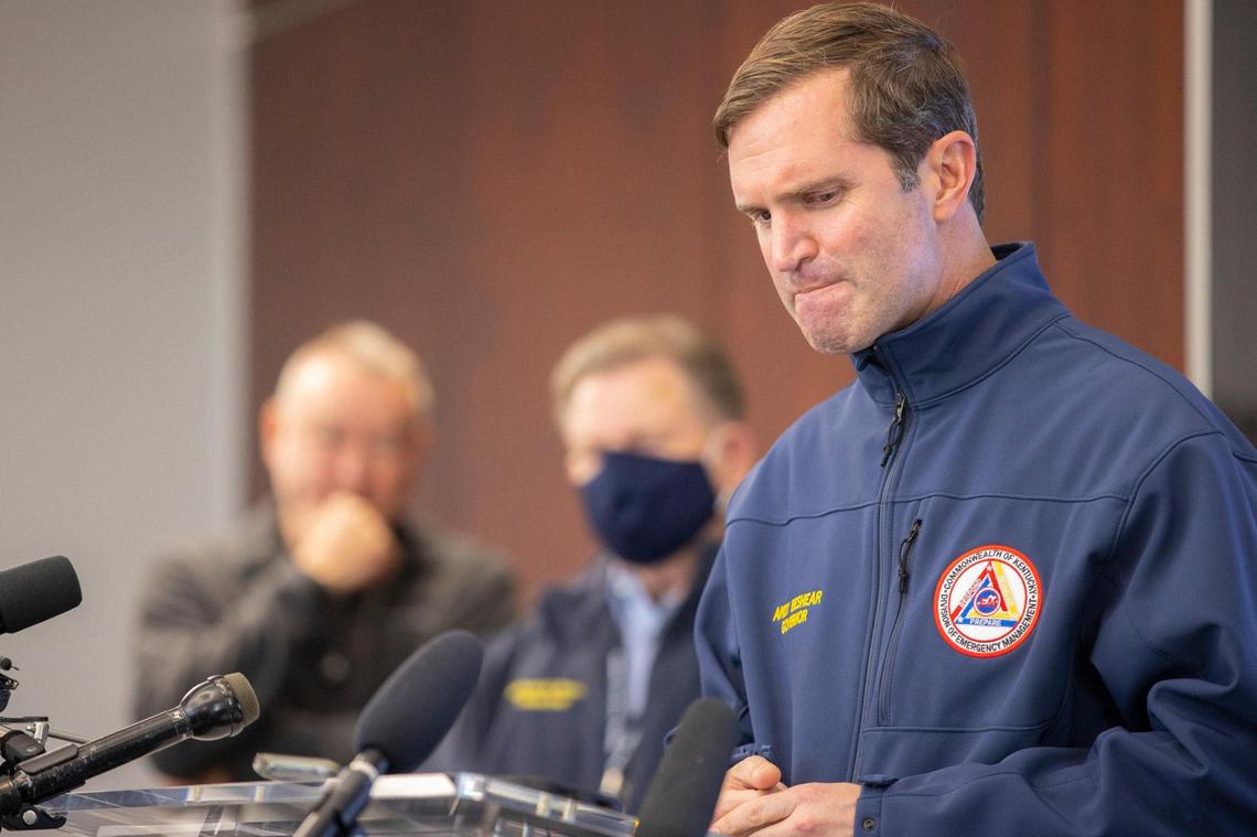 Kentucky Go. Andy Beshear reacts during a Saturday press conference in Mayfield where a tornado traveled through the night before.