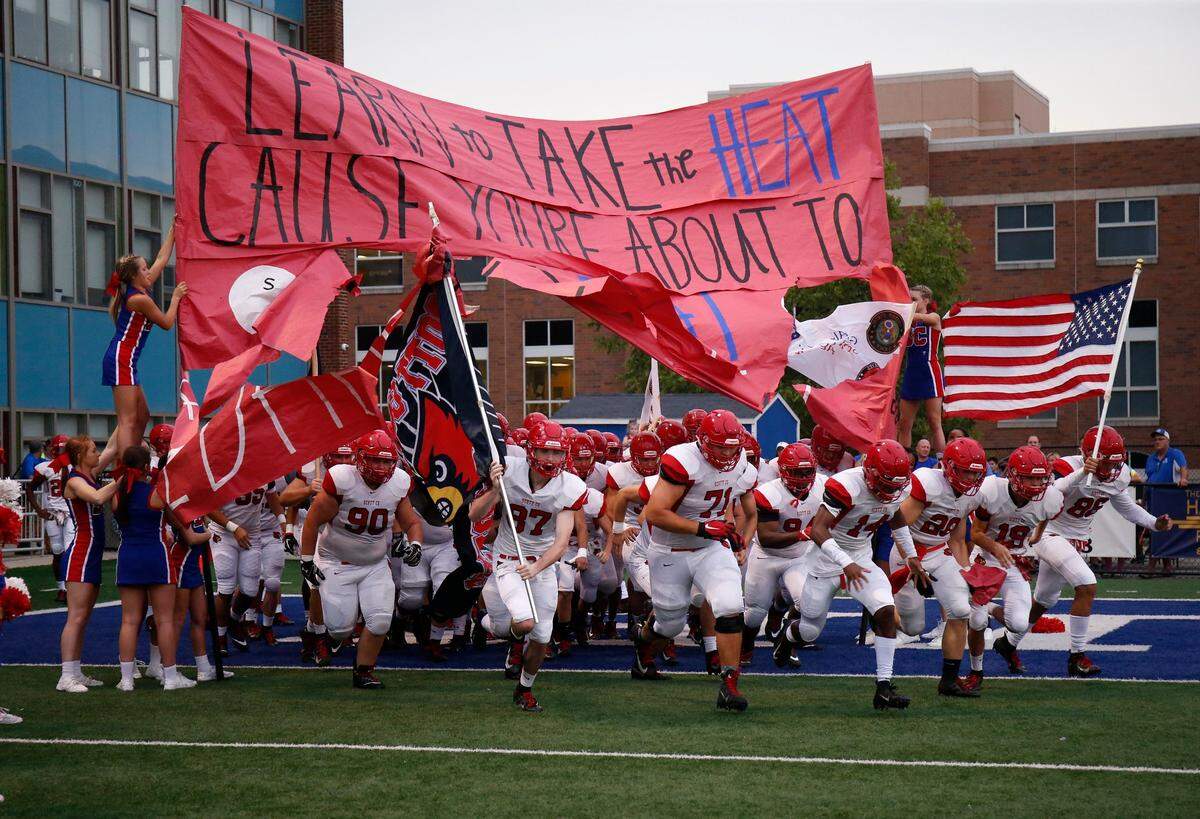 The Scott County football team takes the field against Highlands just before the start of a football game held at Highlands High School in Fort Thomas, Kentucky Friday, Aug. 31, 2018.