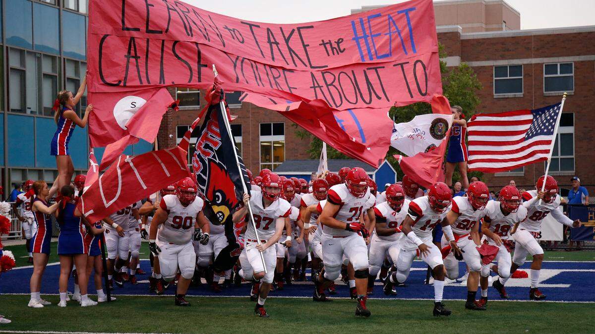 Scott County took field against Highlands before their game Aug. 31, 2018. Football participation statewide has declined in Kentucky in recent years, according to a statistical analysis.