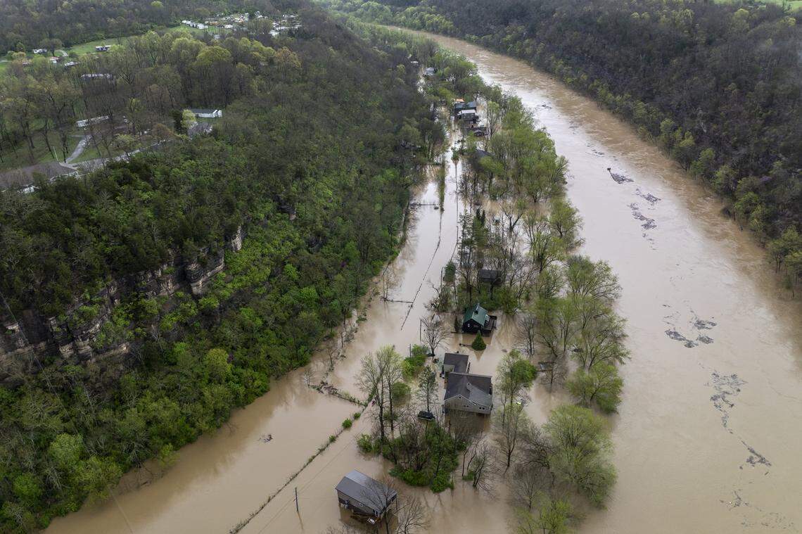 The Kentucky River surrounds homes on Dix Drive near High Bridge in Jessamine County on Saturday, April 5, 2025.