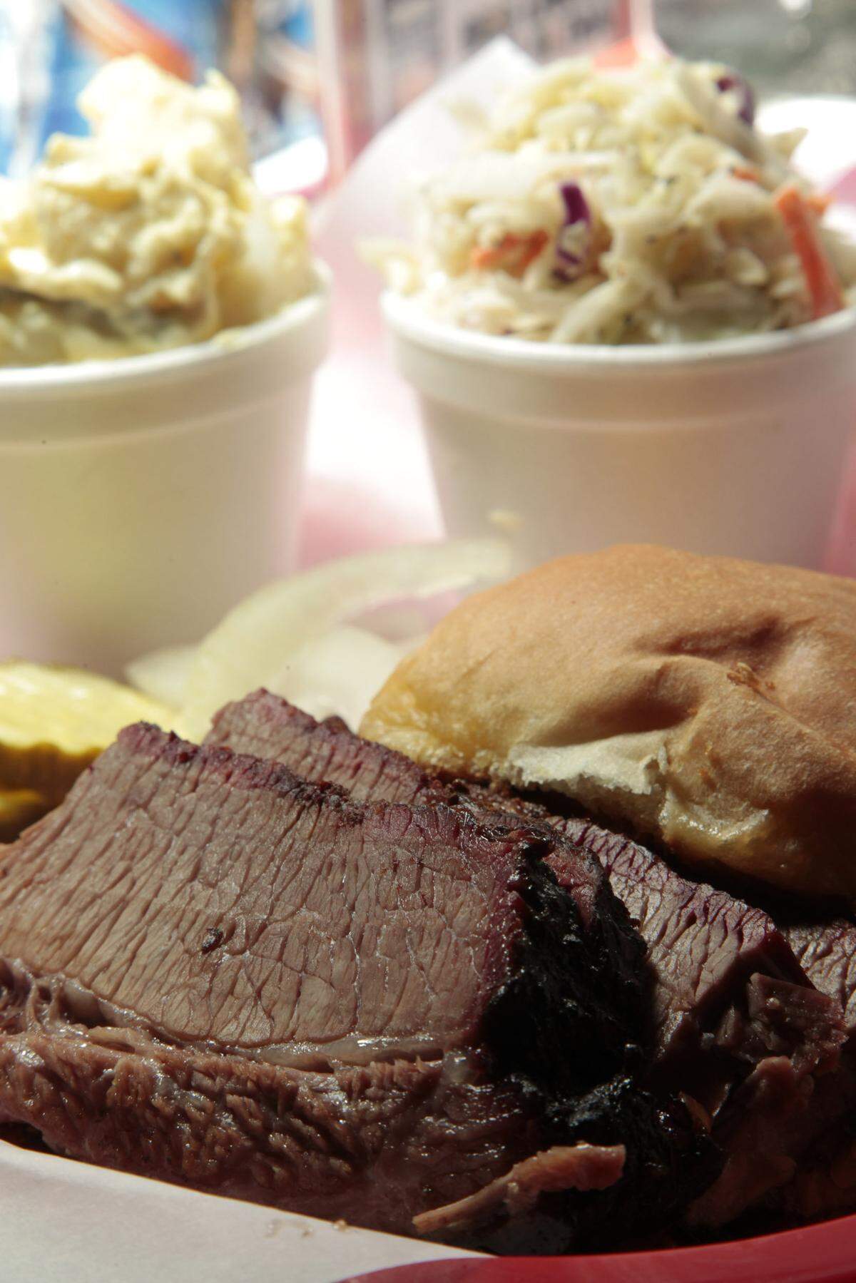 The brisket sandwich at Red State on Georgetown Road has slices falling out of the bun.