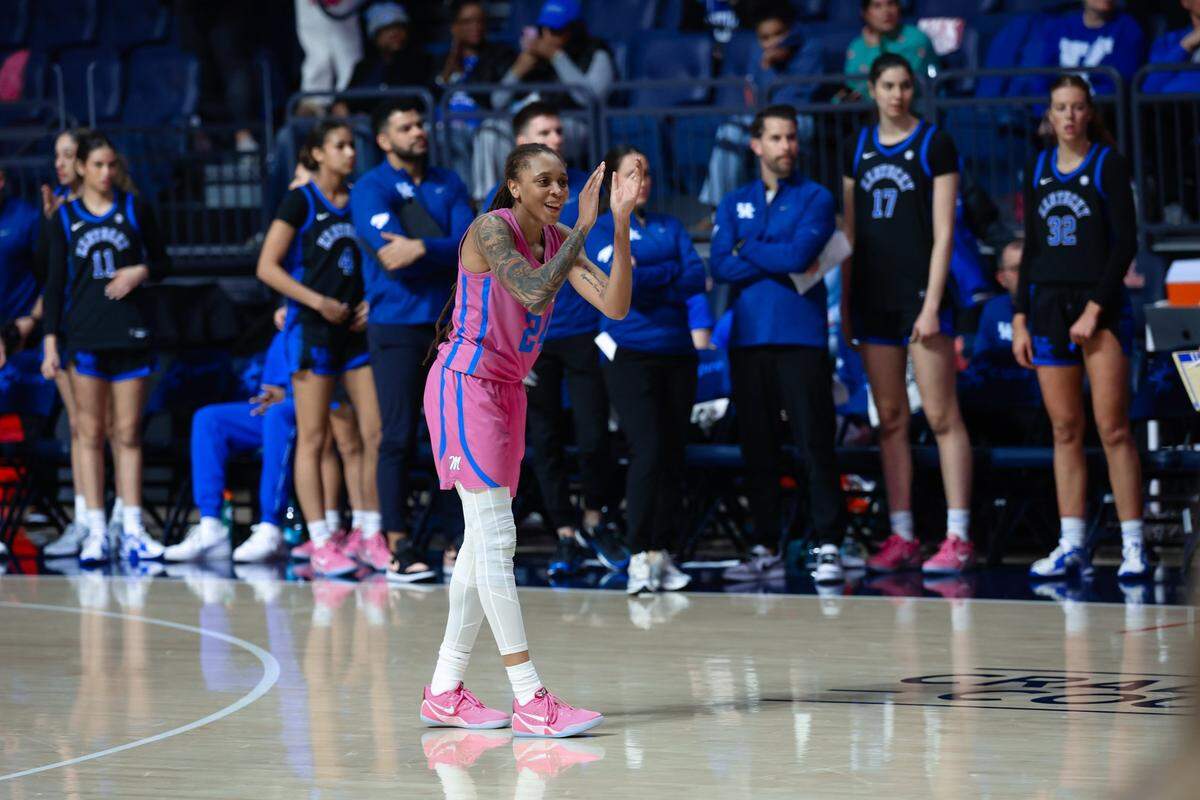 Kentucky’s bench watches Mississippi’s Madison Scott celebrate the Rebels’ victory in Oxford on Monday night. Scott was the game’s high scorer with 22 points.